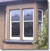 White UPVC Windows - Fitted in Sandstone Frames